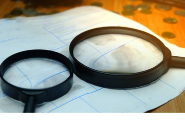 Criminal charges magnifying glass